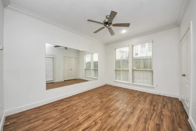 a view of small house with backyard