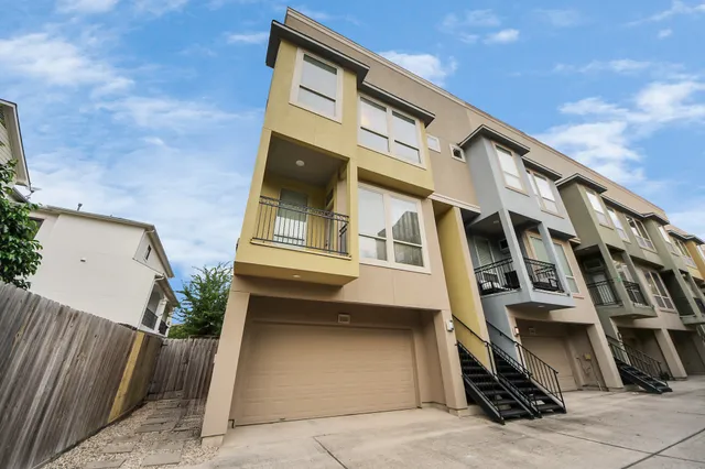 a front view of a house with stairs