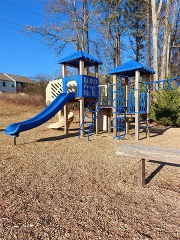 a view of a chairs and table in the patio