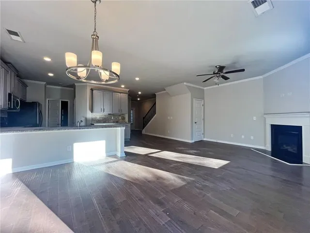 a view of a kitchen with a sink and microwave
