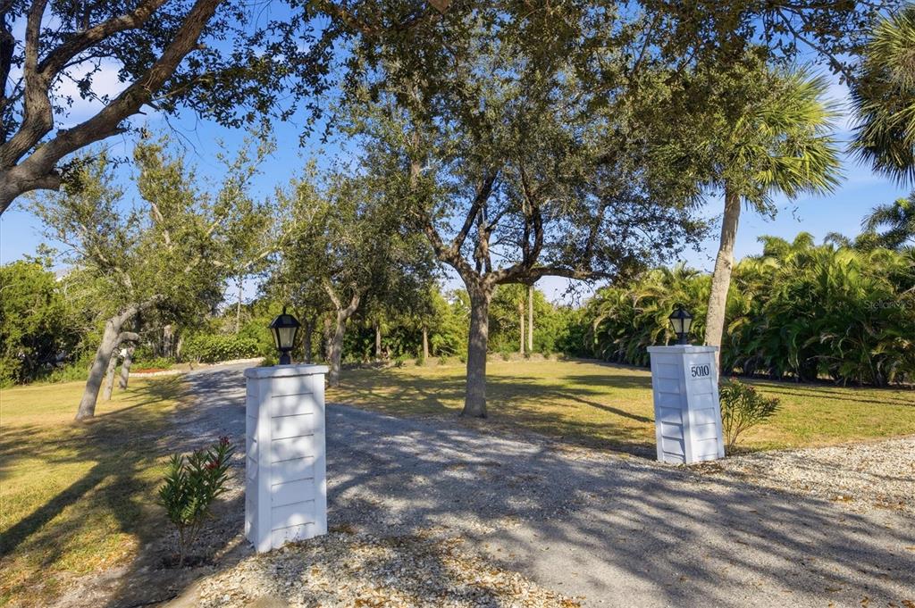 5010 Grouper Hole Court Boca Grande, FL 33921 - Photo 13 of 69 a view of a yard with trees