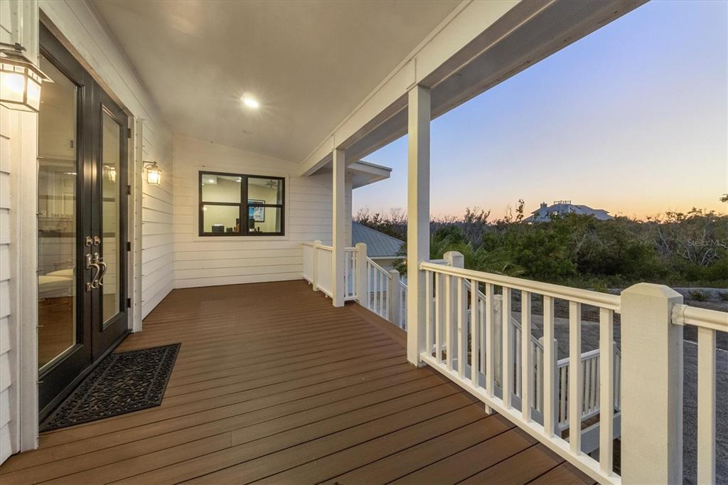 5010 Grouper Hole Court Boca Grande, FL 33921 - Photo 15 of 69 a view of a balcony with wooden floor and fence