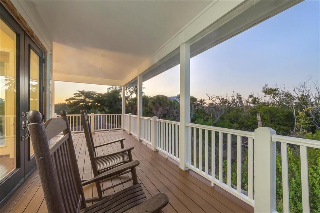 5010 Grouper Hole Court Boca Grande, FL 33921 - Photo 16 of 69 a view of balcony with wooden floor and fence