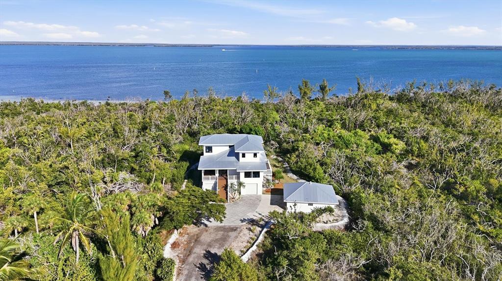 5010 Grouper Hole Court Boca Grande, FL 33921 - Photo 18 of 69 an aerial view of a house with a yard
