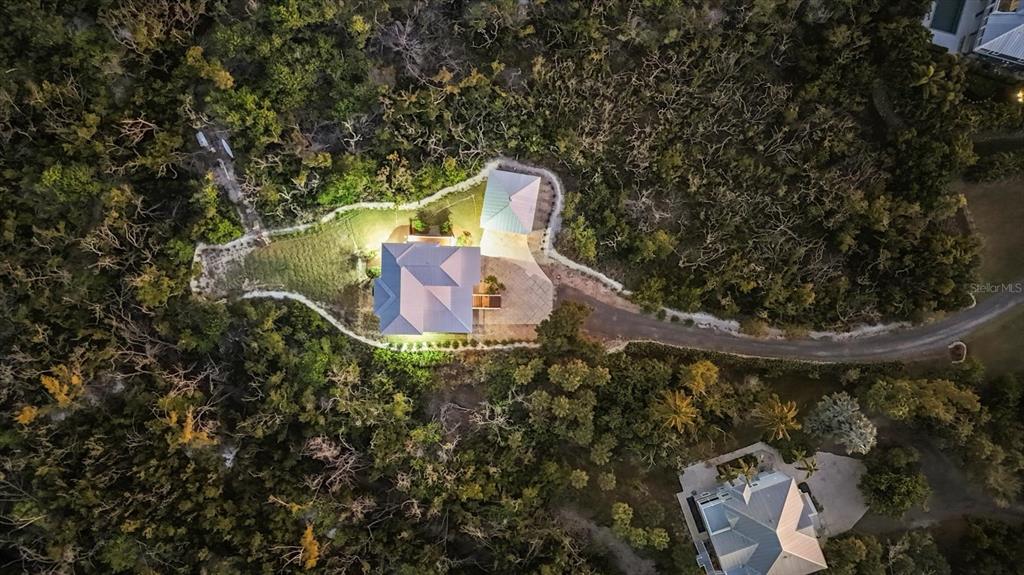 5010 Grouper Hole Court Boca Grande, FL 33921 - Photo 19 of 69 a bird view of a house with a yard and large tree