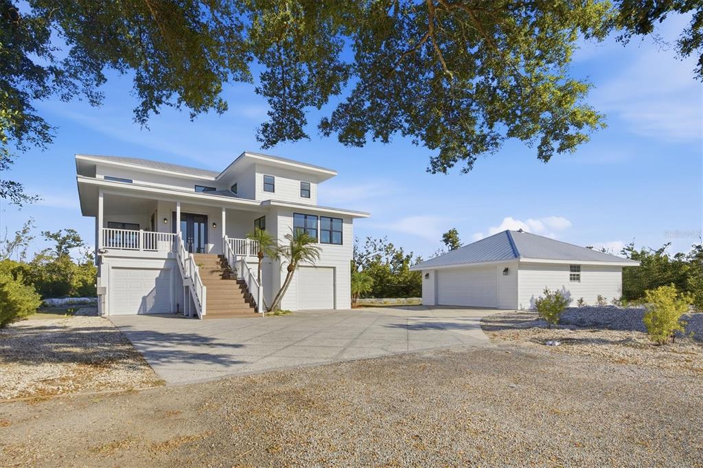 5010 Grouper Hole Court Boca Grande, FL 33921 - Photo 21 of 69 front view of a house with a street