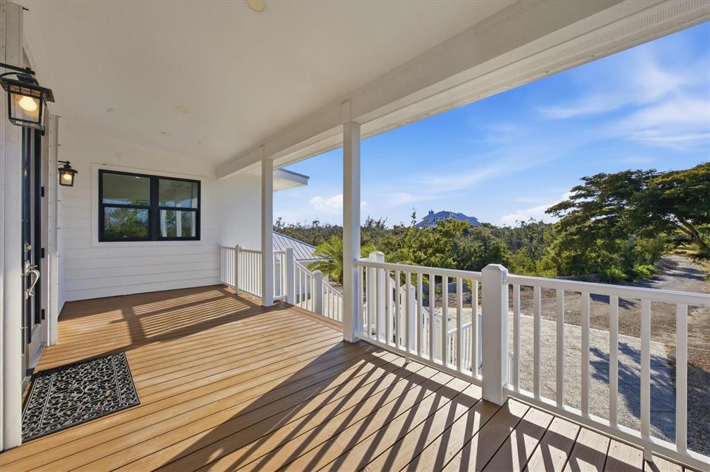 5010 Grouper Hole Court Boca Grande, FL 33921 - Photo 25 of 69 a view of a balcony with wooden floor