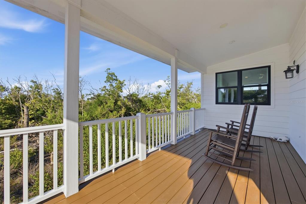 5010 Grouper Hole Court Boca Grande, FL 33921 - Photo 26 of 69 a view of a balcony with chairs