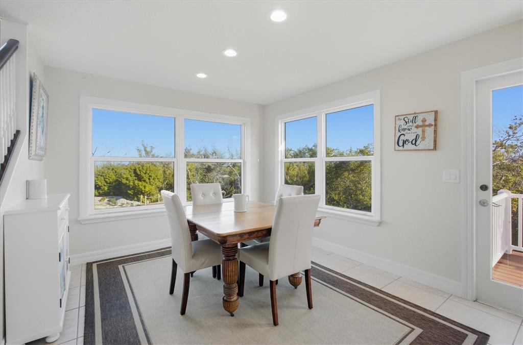 5010 Grouper Hole Court Boca Grande, FL 33921 - Photo 39 of 69 a view of a dining room with furniture window and wooden floor