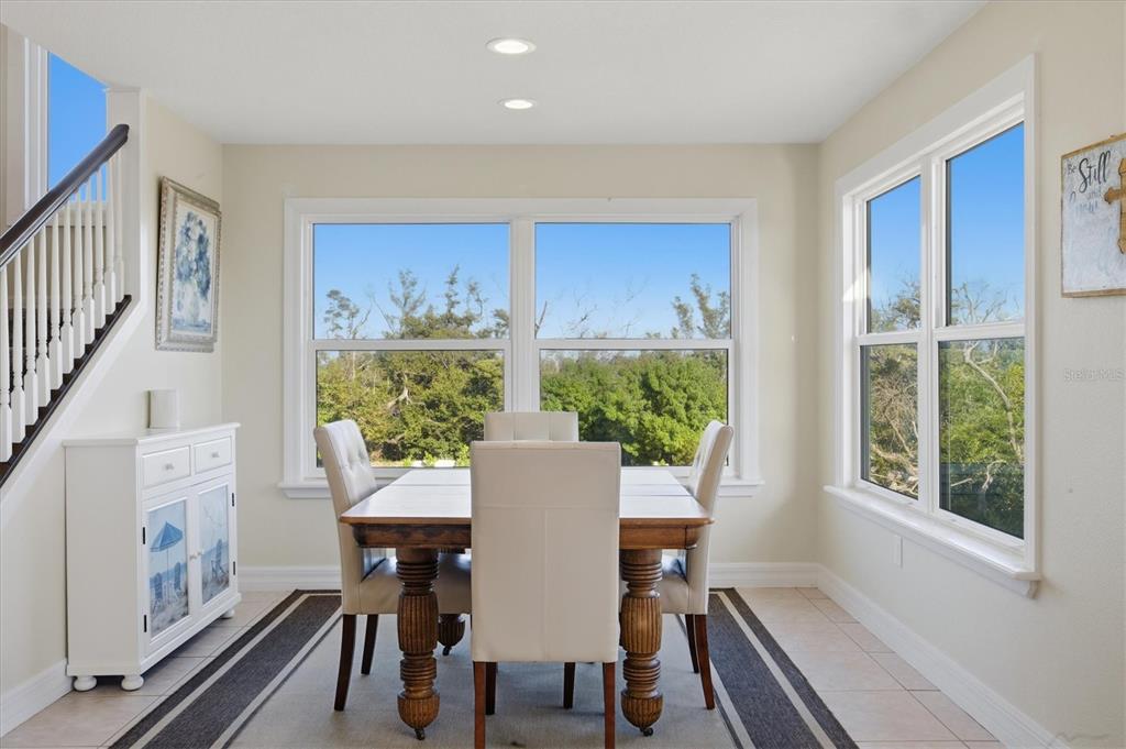 5010 Grouper Hole Court Boca Grande, FL 33921 - Photo 40 of 69 a view of a dining room with furniture window and wooden floor