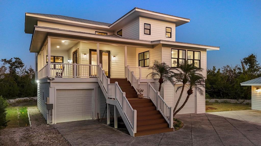 5010 Grouper Hole Court Boca Grande, FL 33921 - Photo 4 of 69 a view of a house with backyard and sitting area