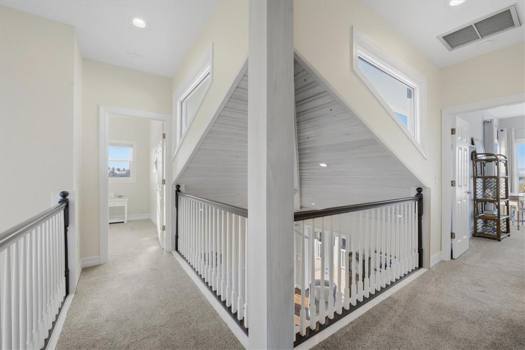 5010 Grouper Hole Court Boca Grande, FL 33921 - Photo 45 of 69 a view of a hallway with staircase