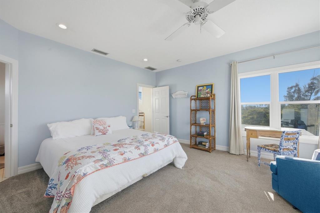 5010 Grouper Hole Court Boca Grande, FL 33921 - Photo 47 of 69 a bedroom with a large bed and a window