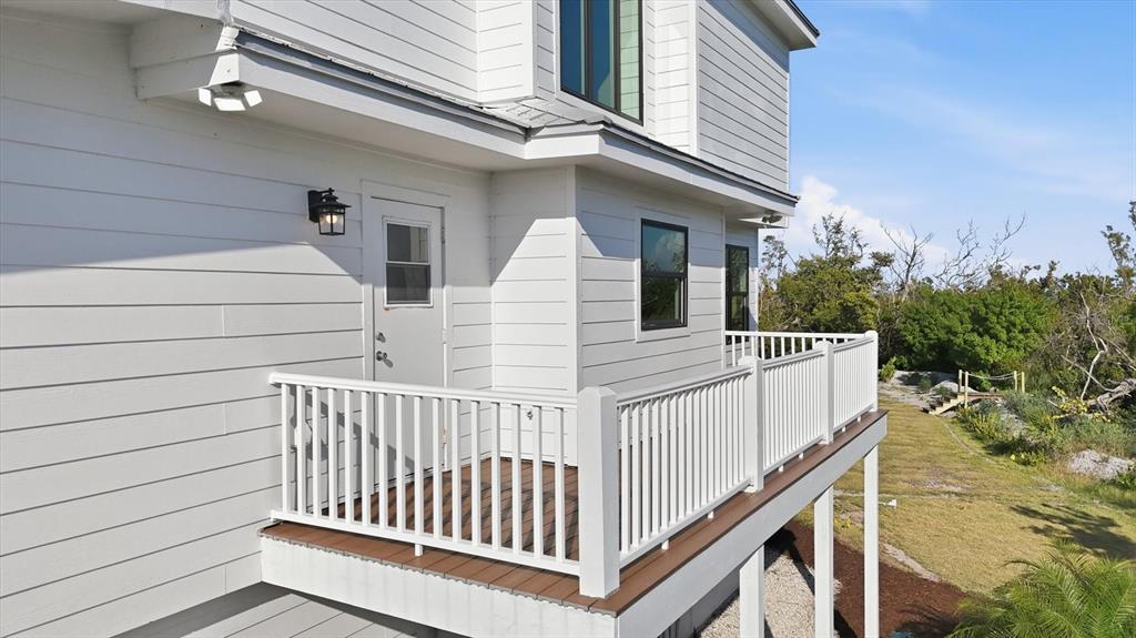 5010 Grouper Hole Court Boca Grande, FL 33921 - Photo 48 of 69 a view of a house with wooden deck