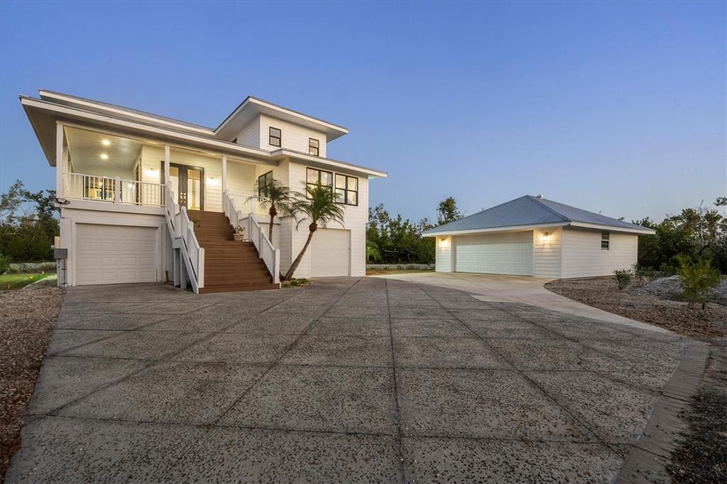 5010 Grouper Hole Court Boca Grande, FL 33921 - Photo 7 of 69 a front view of a house with garden