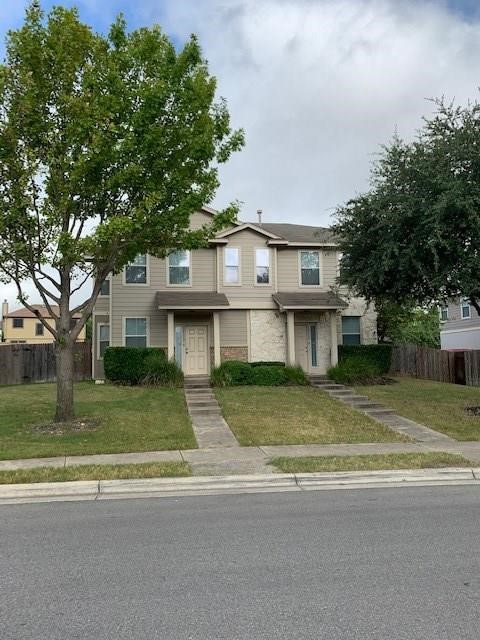 14112 Harris Ridge Boulevard, Unit B Pflugerville, TX 78660 - Photo 1 of 16 a view of a house with a swimming pool