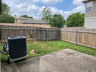 14112 Harris Ridge Boulevard, Unit B Pflugerville, TX 78660 - Photo 16 of 16 a view of a backyard with wooden fence