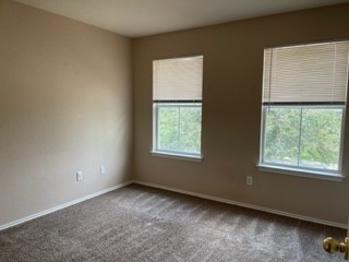 14112 Harris Ridge Boulevard, Unit B Pflugerville, TX 78660 - Photo 2 of 16 an empty room with a window