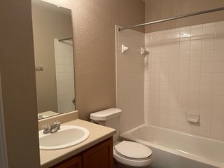 14112 Harris Ridge Boulevard, Unit B Pflugerville, TX 78660 - Photo 4 of 16 a bathroom with a sink toilet and shower