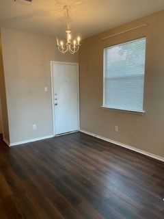 14112 Harris Ridge Boulevard, Unit B Pflugerville, TX 78660 - Photo 9 of 16 a view of an empty room with wooden floor and a window
