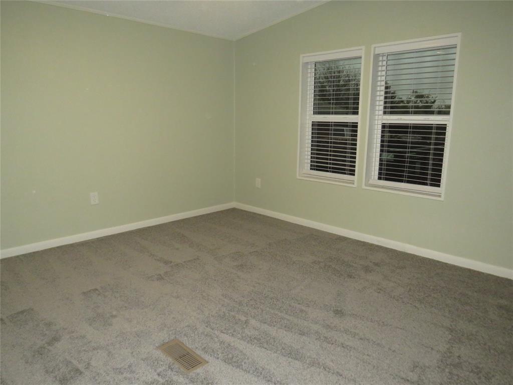 2151 Crockett Road Sanger, TX 76266 - Photo 13 of 30 an empty room with a window