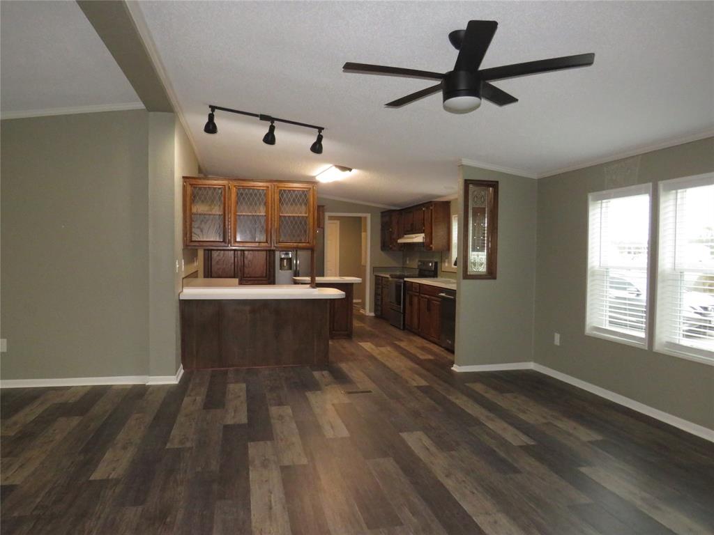 2151 Crockett Road Sanger, TX 76266 - Photo 15 of 30 a view of kitchen with sink microwave and refrigerator