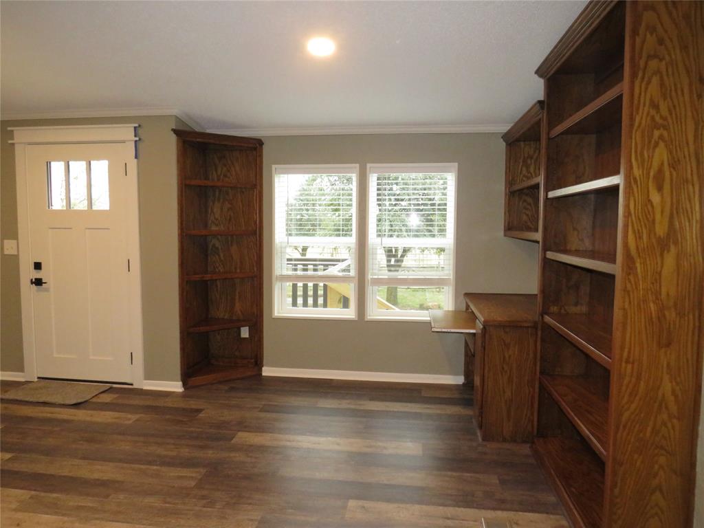 2151 Crockett Road Sanger, TX 76266 - Photo 19 of 30 a view of wooden floor and windows in a room