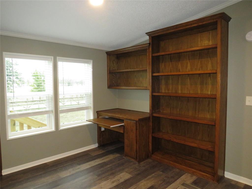 2151 Crockett Road Sanger, TX 76266 - Photo 20 of 30 a view of room with window and wooden floor