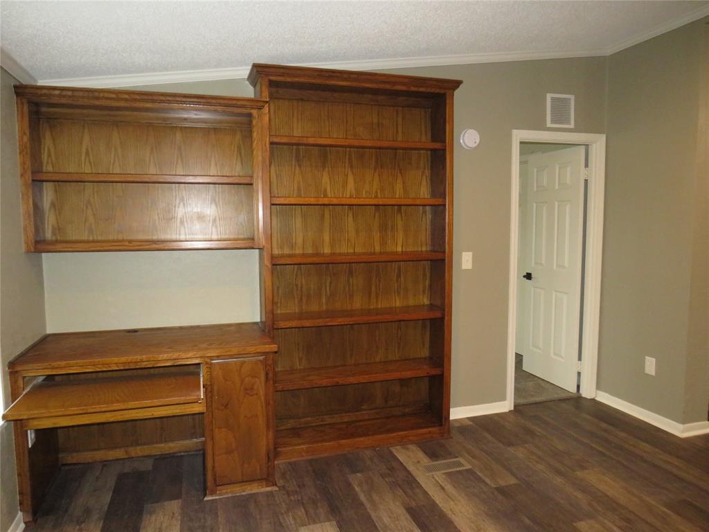 2151 Crockett Road Sanger, TX 76266 - Photo 21 of 30 a view of walk in closet with empty racks