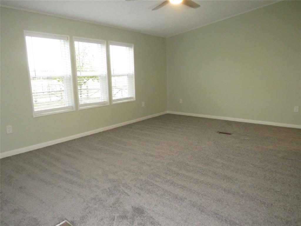 2151 Crockett Road Sanger, TX 76266 - Photo 22 of 30 an empty room with a window