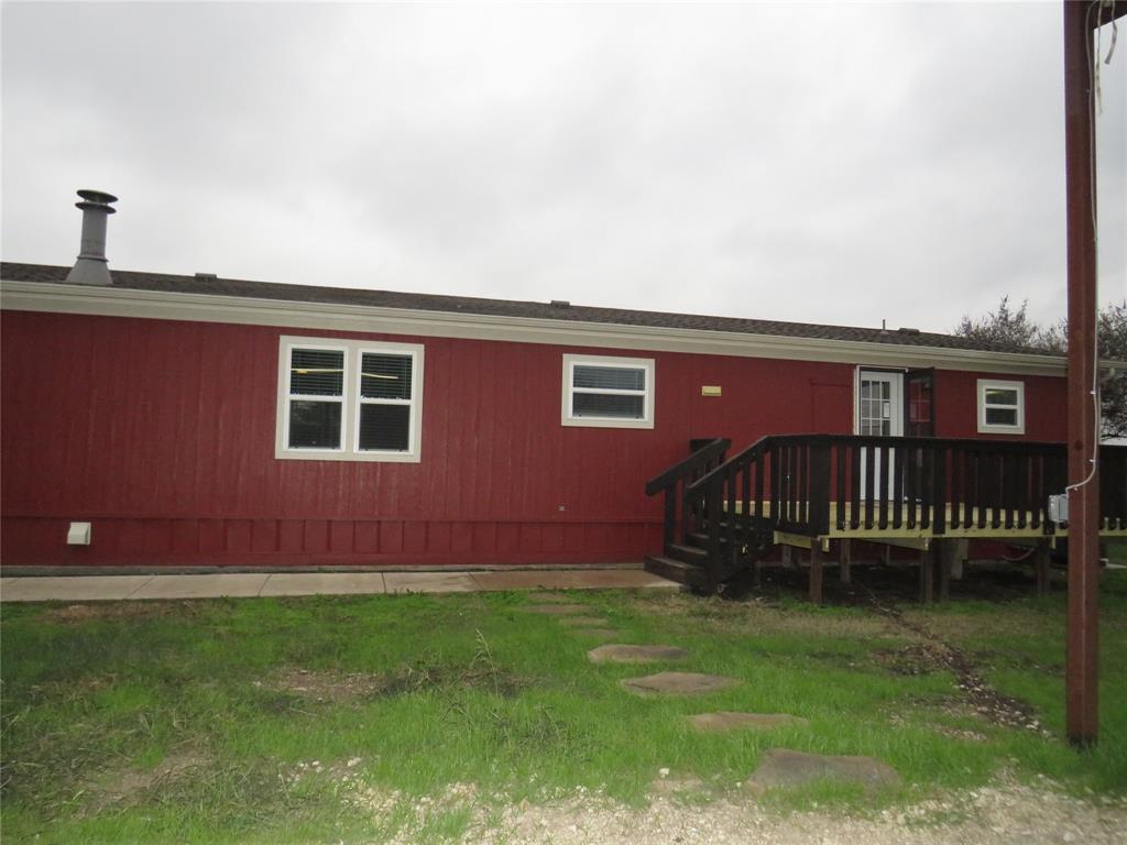 2151 Crockett Road Sanger, TX 76266 - Photo 29 of 30 a front view of a house with garden