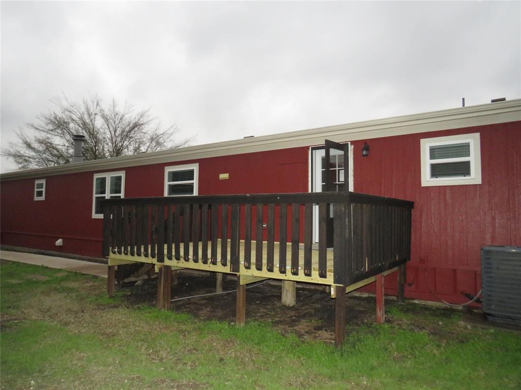 2151 Crockett Road Sanger, TX 76266 - Photo 30 of 30 a backyard of a house with table and chairs