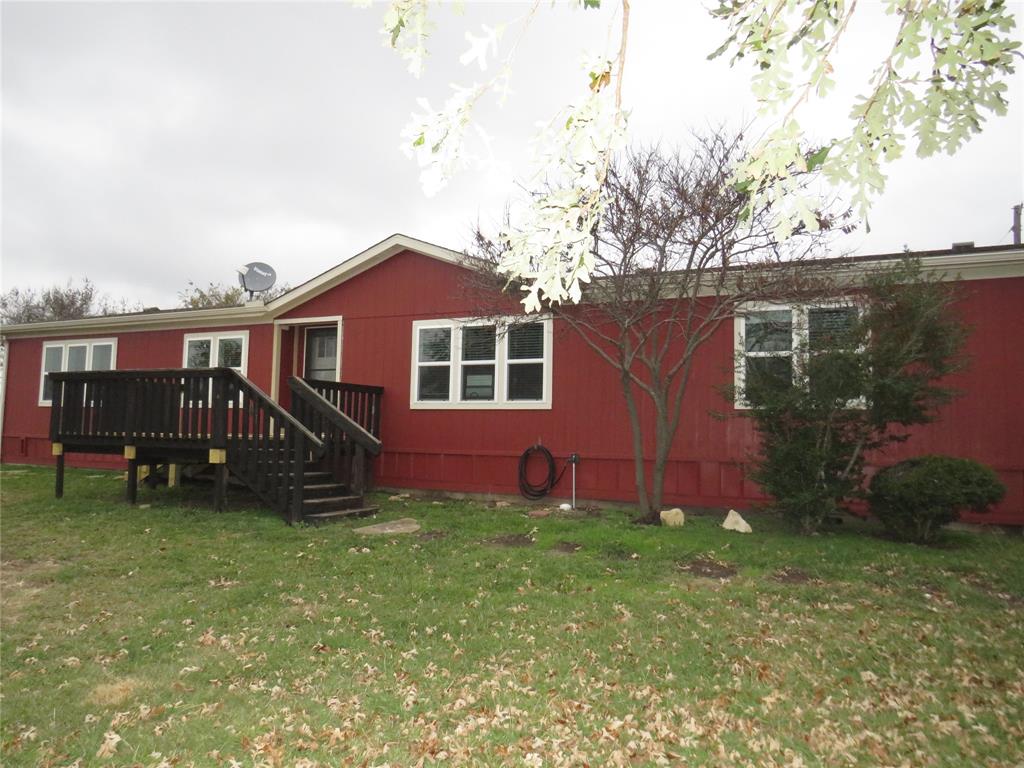 2151 Crockett Road Sanger, TX 76266 - Photo 3 of 30 a view of a house with a yard and sitting area