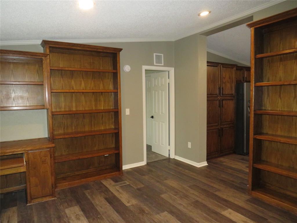 2151 Crockett Road Sanger, TX 76266 - Photo 4 of 30 a view of walk in closet with empty racks
