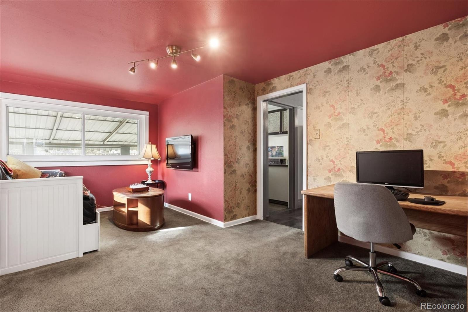 1275 Clinton Street Aurora, CO 80010 - Photo 11 of 33 a view of a workspace with furniture and a window