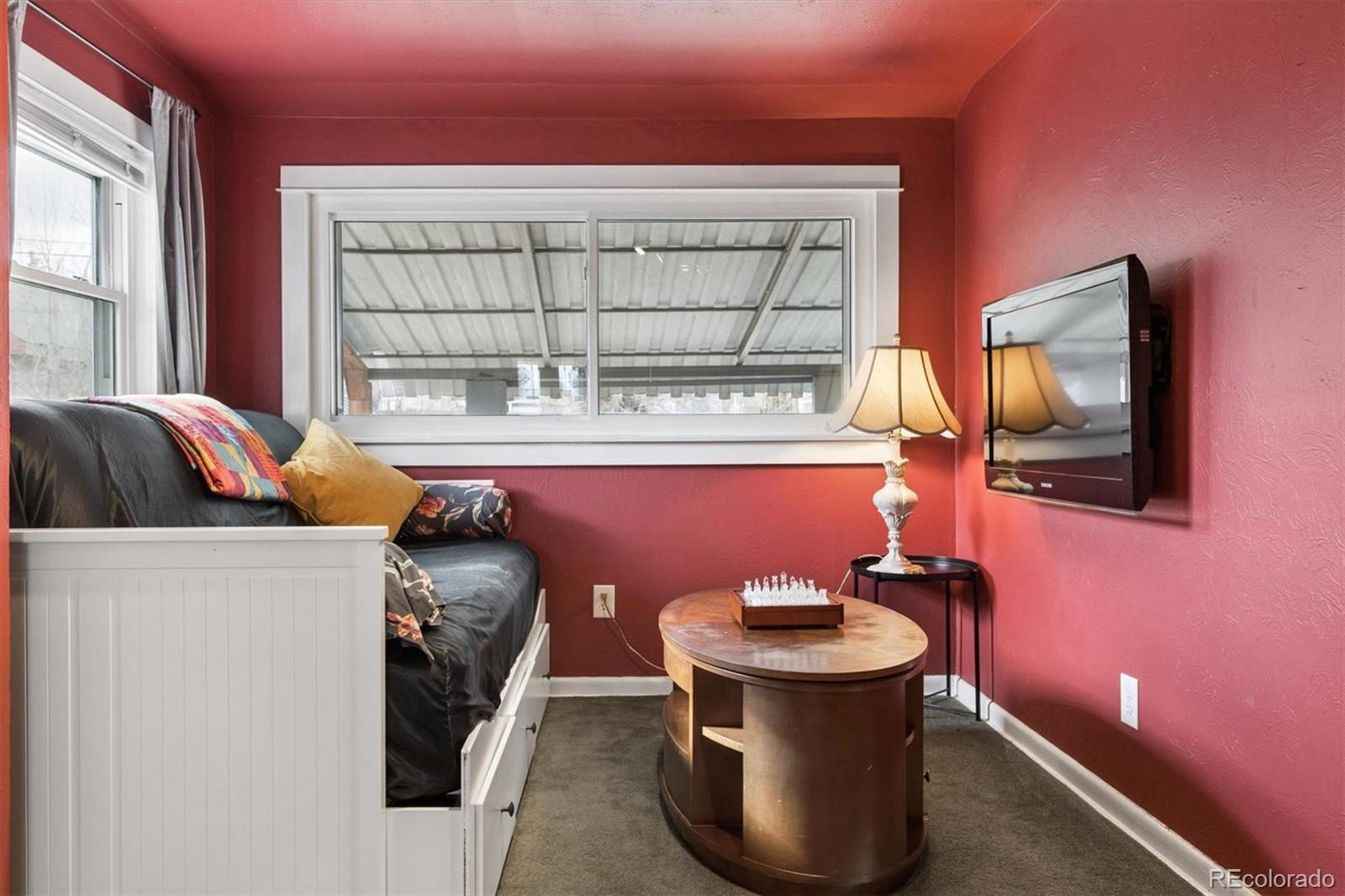 1275 Clinton Street Aurora, CO 80010 - Photo 12 of 33 a bathroom with a sink toilet and mirror