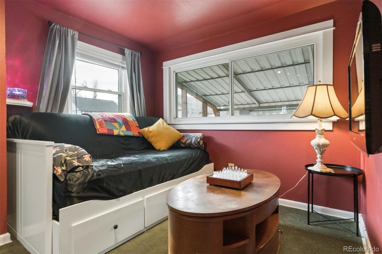 1275 Clinton Street Aurora, CO 80010 - Photo 13 of 33 a living room with furniture and a window