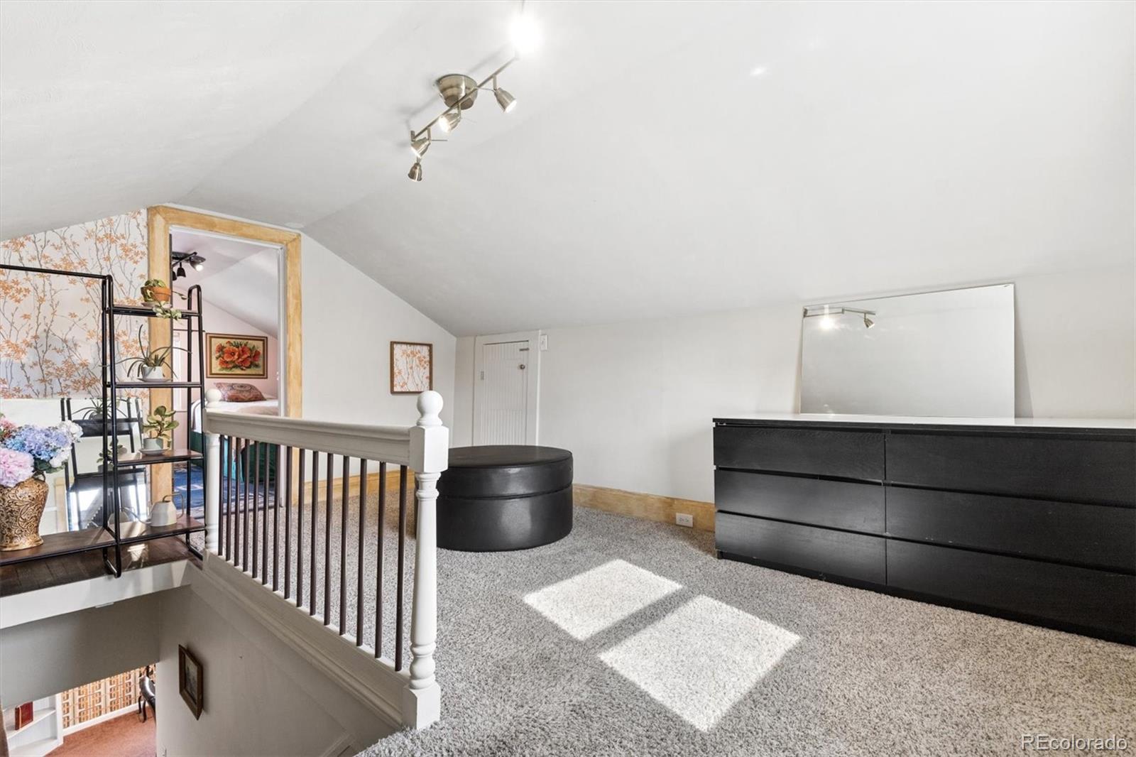 1275 Clinton Street Aurora, CO 80010 - Photo 21 of 33 a view of a livingroom with furniture and staircase