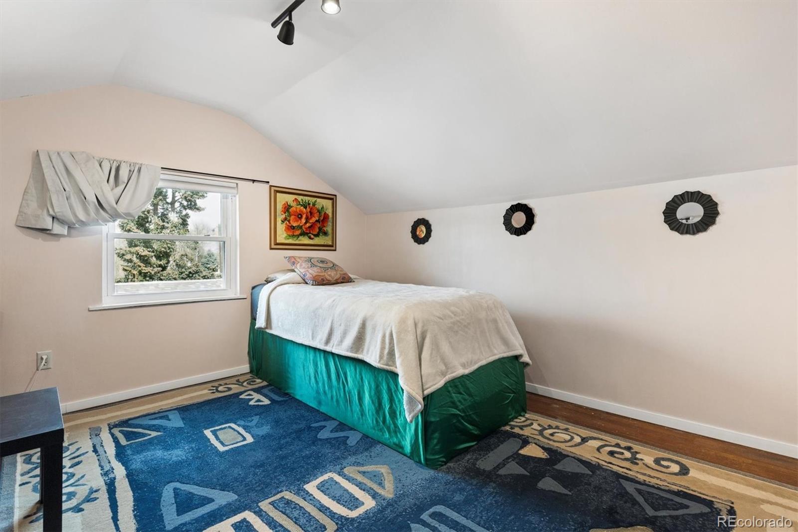 1275 Clinton Street Aurora, CO 80010 - Photo 24 of 33 a bedroom with a bed and a window