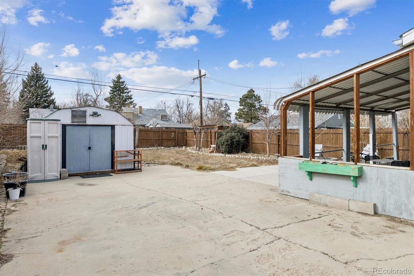1275 Clinton Street Aurora, CO 80010 - Photo 25 of 33 a view of a house with backyard and sitting area