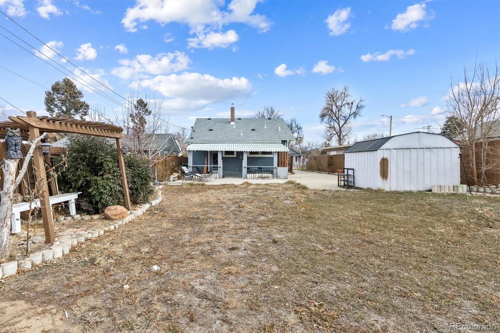 1275 Clinton Street Aurora, CO 80010 - Photo 29 of 33 a front view of a house with a yard