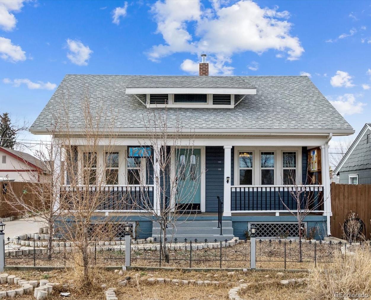 1275 Clinton Street Aurora, CO 80010 - Photo 30 of 33 a front view of a house with a fence