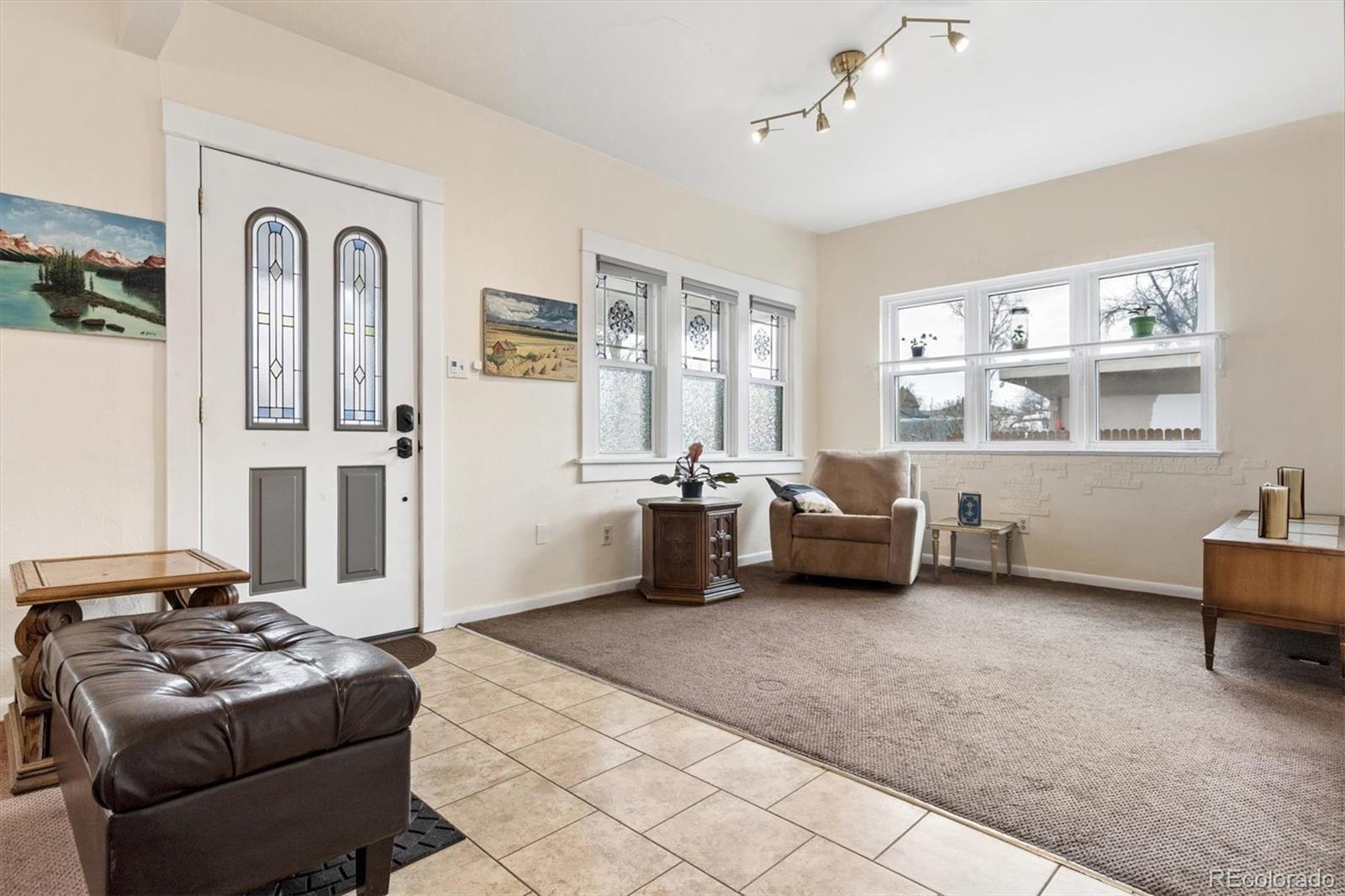 1275 Clinton Street Aurora, CO 80010 - Photo 5 of 33 a bedroom with furniture and a window