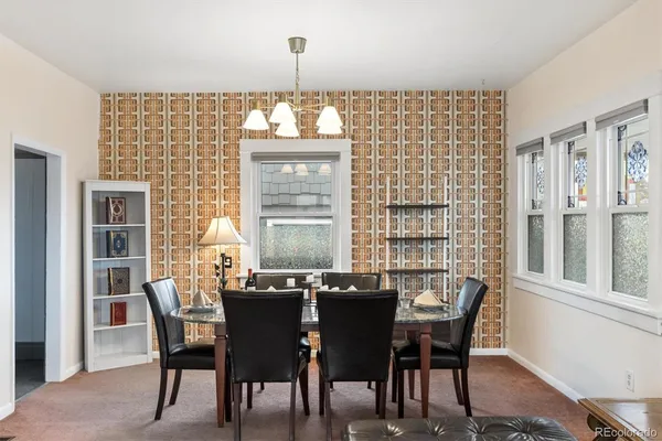 a view of a dining room with furniture window and outside view