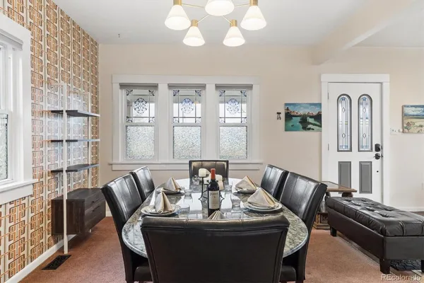 a dining room with furniture and window