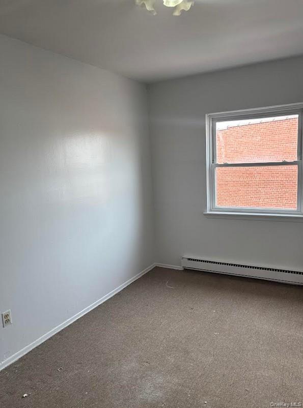 91-04 75th Street, Unit 2 Queens, NY 11421 - Photo 4 of 7 an empty room with a window