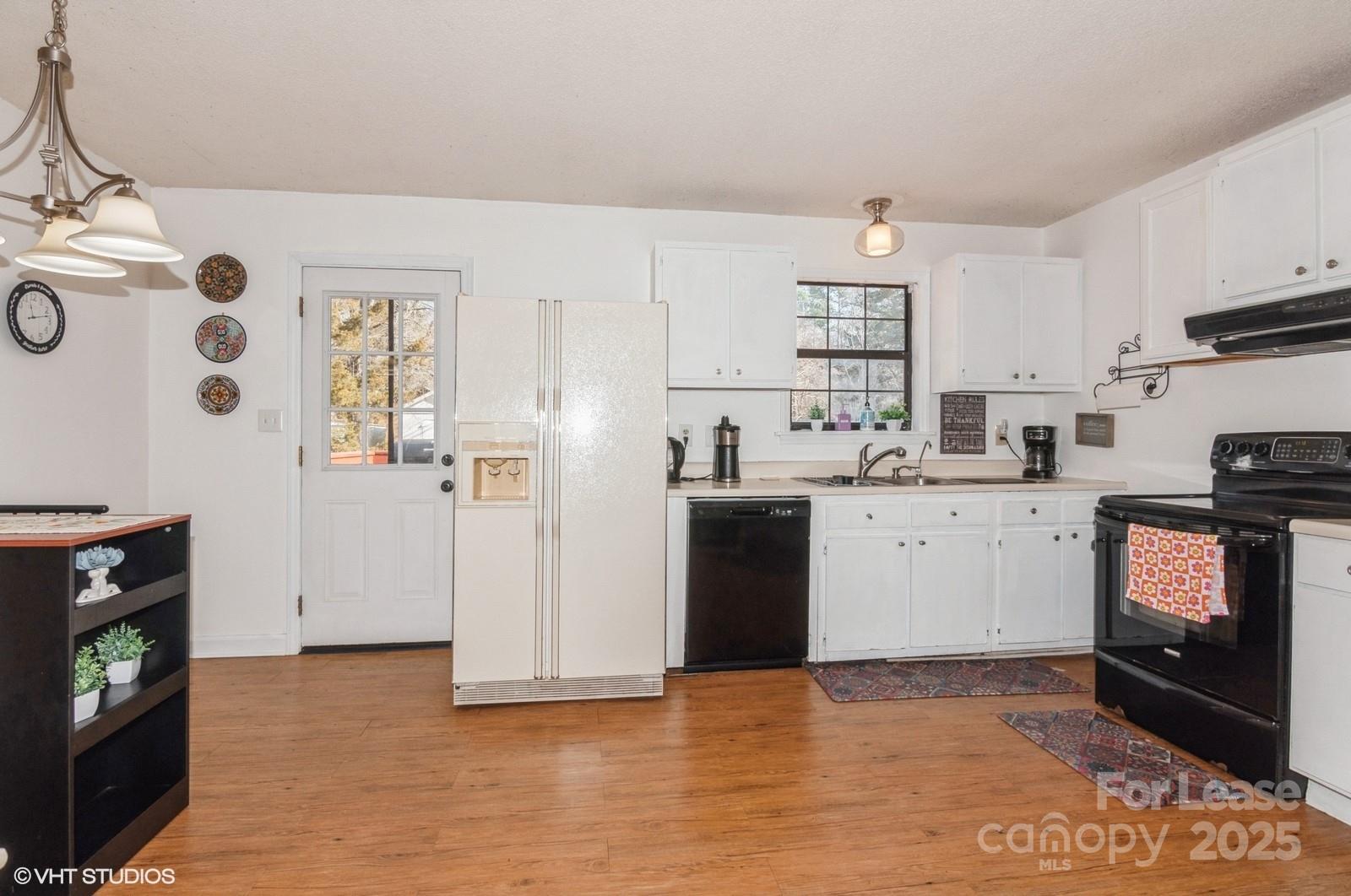 9938 Sandra Lane Fort Mill, SC 29707 - Photo 11 of 36 a kitchen with granite countertop a refrigerator stove and sink