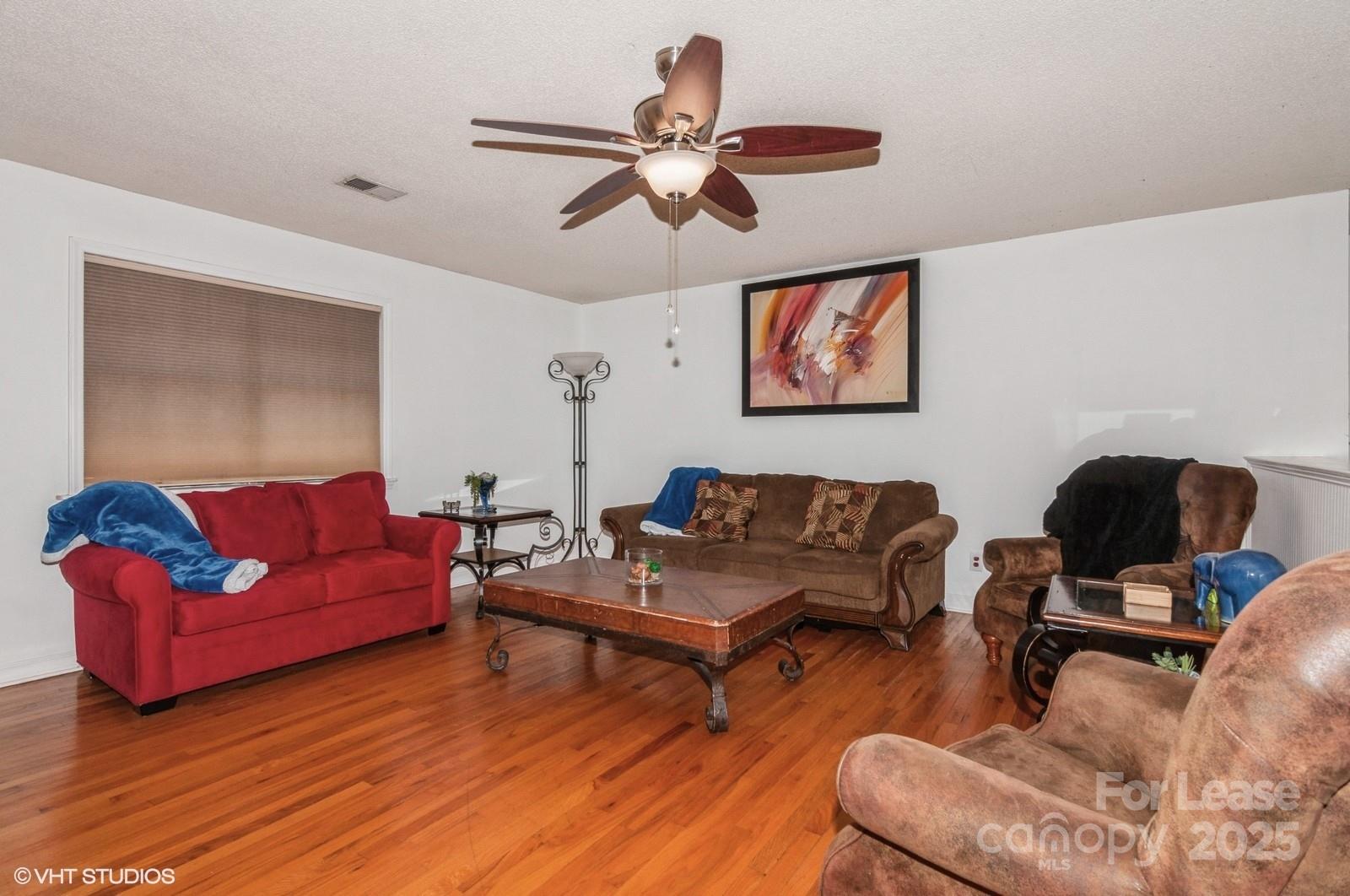 9938 Sandra Lane Fort Mill, SC 29707 - Photo 12 of 36 a living room with furniture and wooden floor