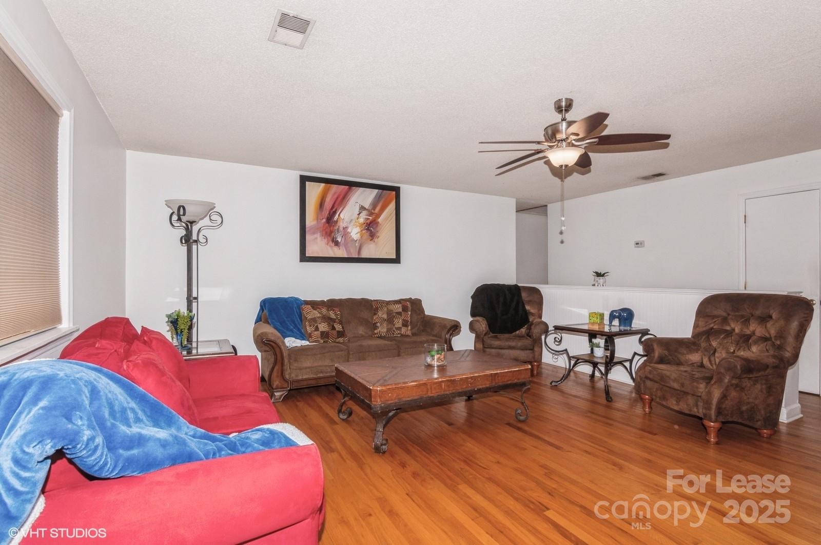 9938 Sandra Lane Fort Mill, SC 29707 - Photo 13 of 36 a living room with furniture and wooden floor