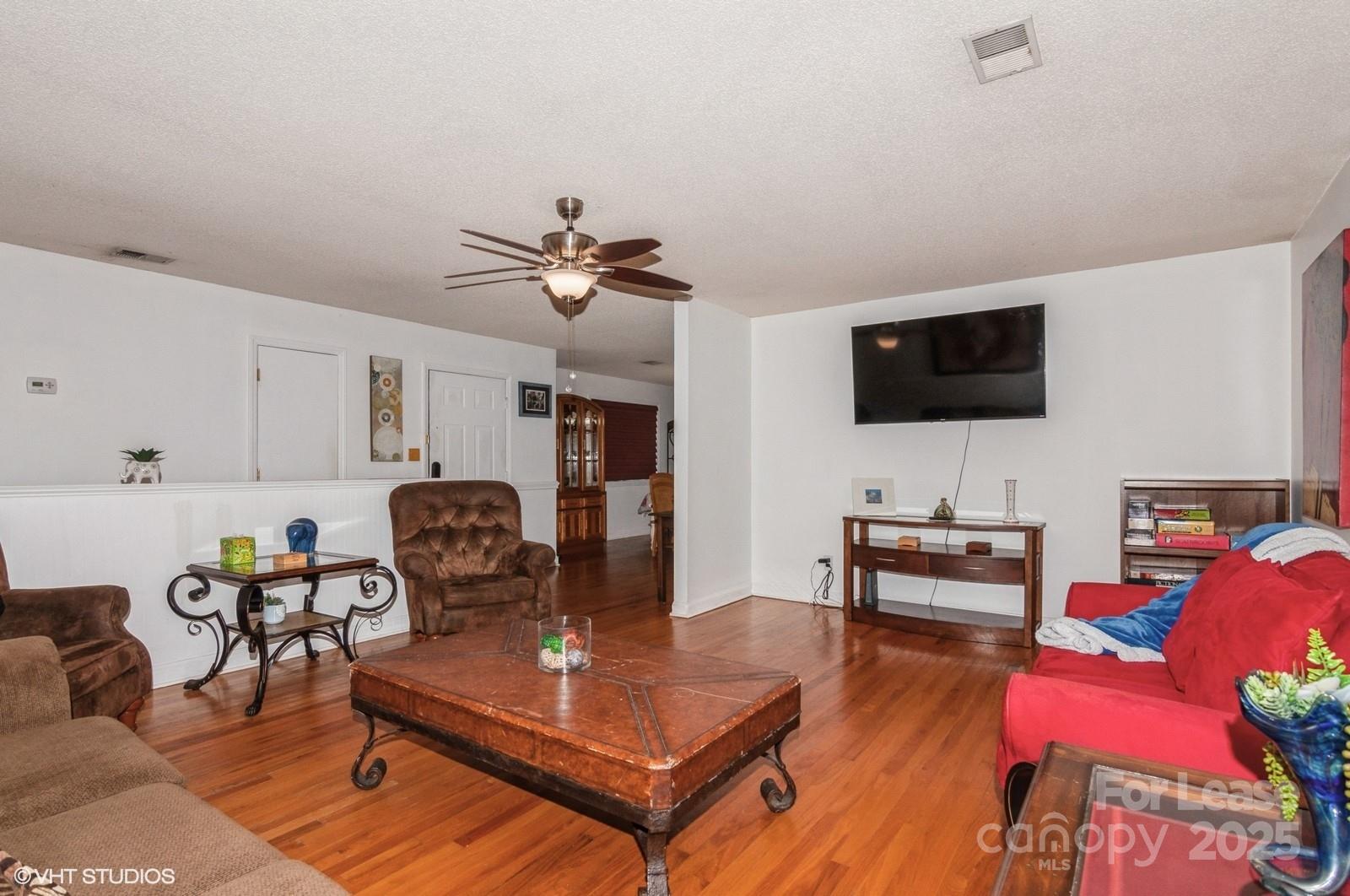 9938 Sandra Lane Fort Mill, SC 29707 - Photo 14 of 36 a living room with furniture and a flat screen tv